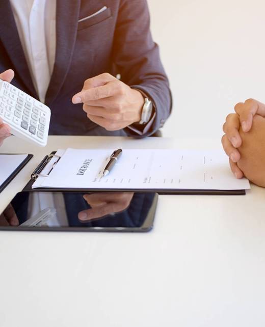 Sales manager giving advice application form document, considering mortgage loan offer for car and house insurance